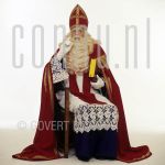 Sinterklaas, Bram van der Vlugt at studio in Amsterdam.

[keywords]Posed, Full Length, Book, Chair, Thinking[/keywords]